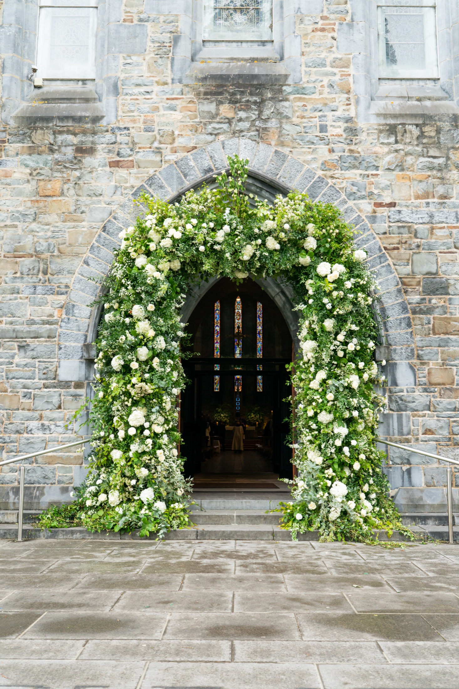 Castle doorway framed with a luxury floral arch