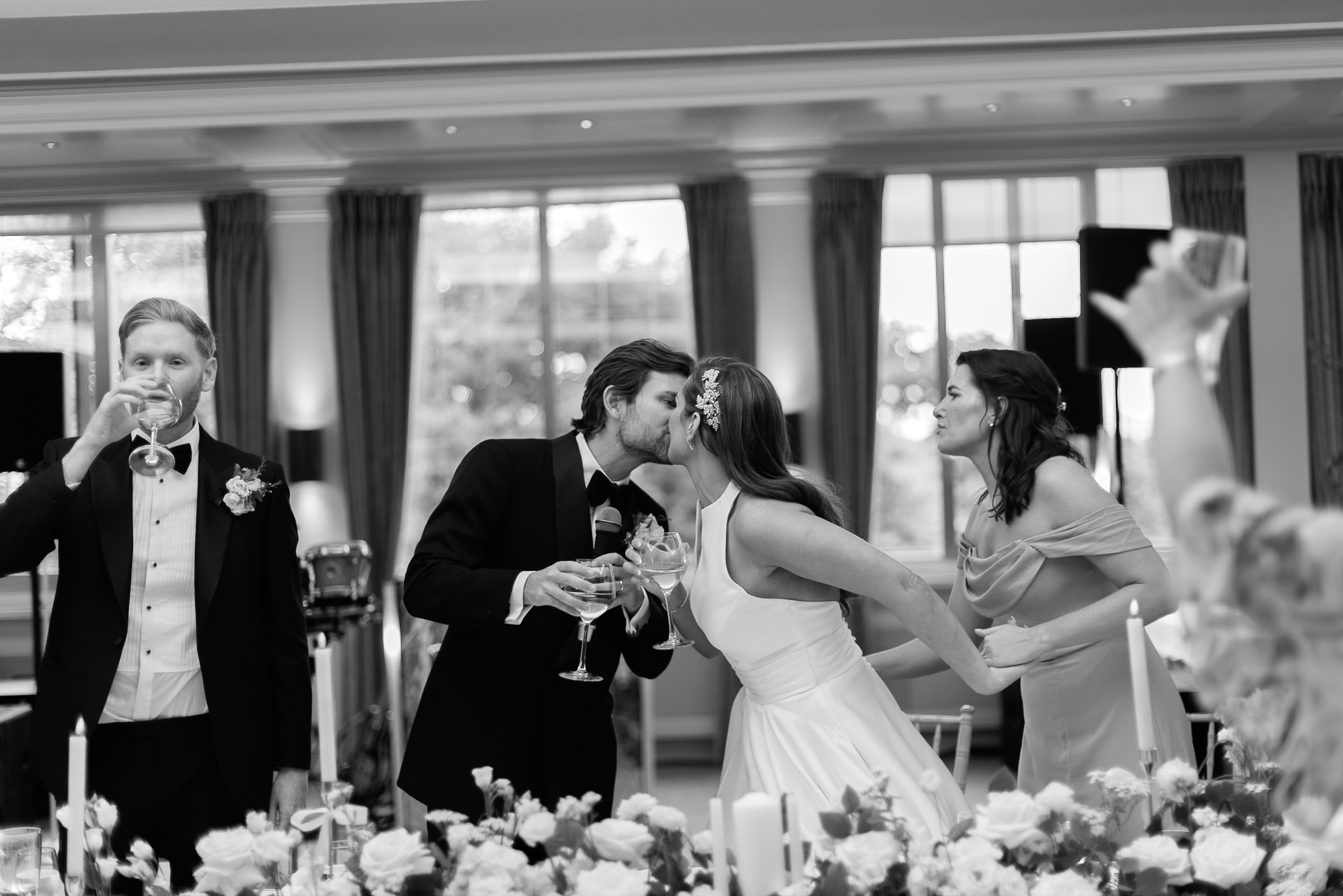 Guests laughing together at a wedding reception